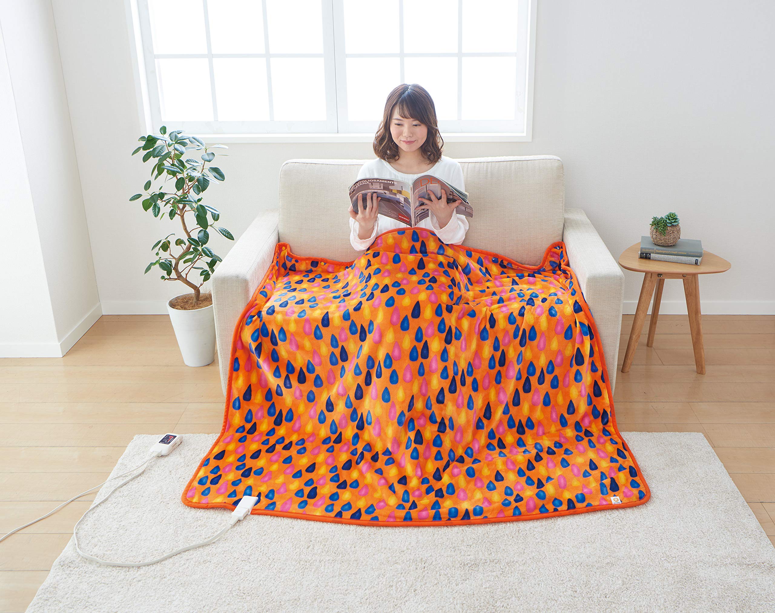 The Sugibo Hot Blanket Wide x 140 featuring a stylish Raindrops is made in Japan and comes in Sunset Orange (140 cm), design, (SB20BW13(SO)).