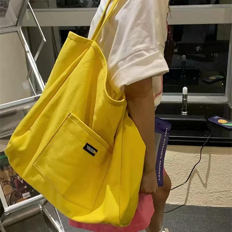 Nische einfarbige Canvas-Tasche Tasche 2025 neue koreanische Version Ins-Stil Umhängetasche einfache lässige große Kapazität Tragetasche