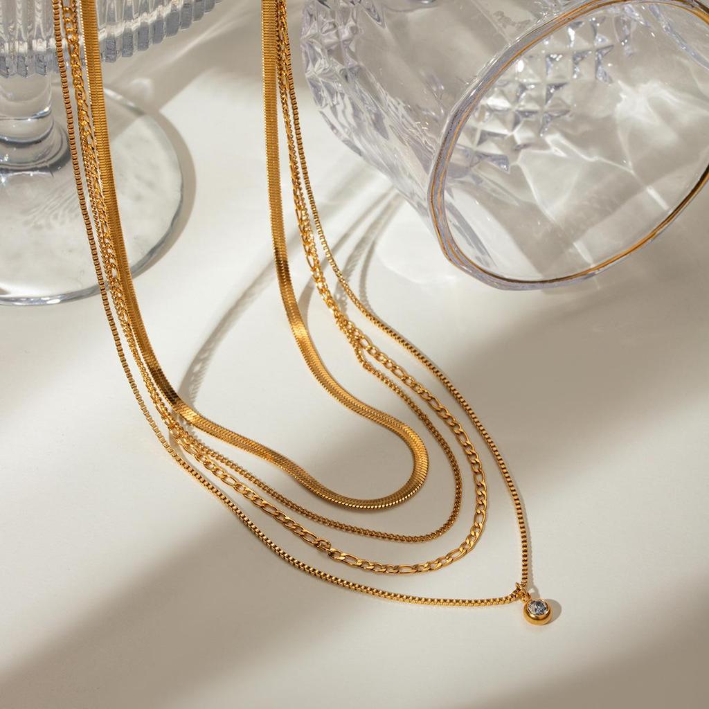 European & American Influencer Fashion Necklace: 18K Gold Stainless Steel Four-Layer Chain with Diamond Pendant.