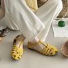 Leather hollow woven bag head Roman sandals women's literary style casual versatile comfortable flat T-button pig cage shoes