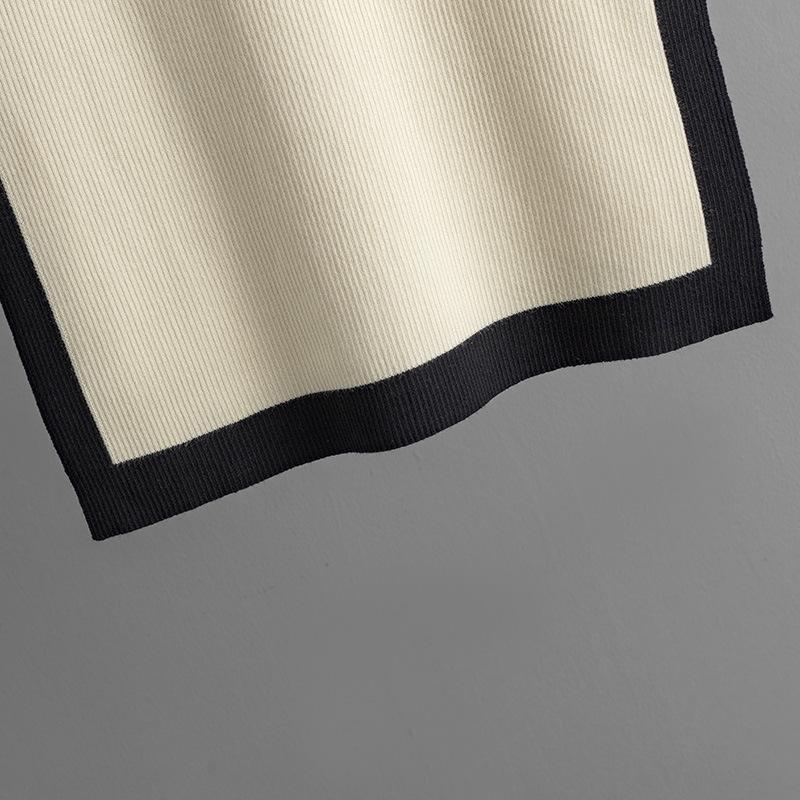 GMXIA Knitwear Set for Women's Autumn Design: A Two-piece Outfit Featuring A Contrasting Color Round-neck Top and A Slit Skirt, Exuding Elegance