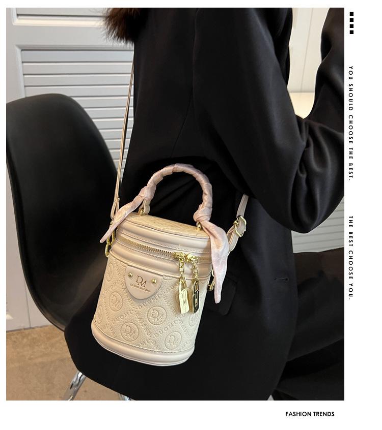 Autumn 2024 Trendy Women's Round Bucket Crossbody Bag: Solid Color, Textured, Hand-Held, and Stylish.