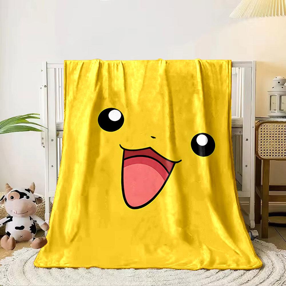 Bright yellow smiling face with large black eyes and an open pink mouth. for all seasons blanket lunch break throw gift 80cm x 120cm
