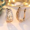Hollow pattern with diamond engraved ear buckles, retro curly grass pattern earrings, high-end versatile earrings.