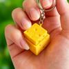 Breloczek Umbra Studio Symulowany Ser Clicker Fidget, Kostka Clicker do Palców Drukowana 3D, Zabawka Przyciskowa do Redukcji Lęku i Stresu do Biura i Klasy