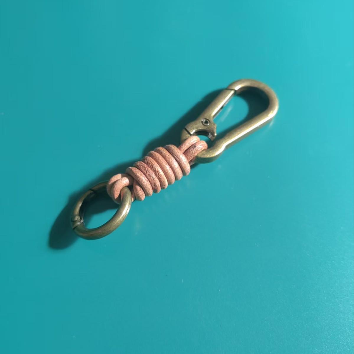 Punk Retro Genuine Leather Keyring: Distressed Woven Cowhide Charm with Climbing Buckle