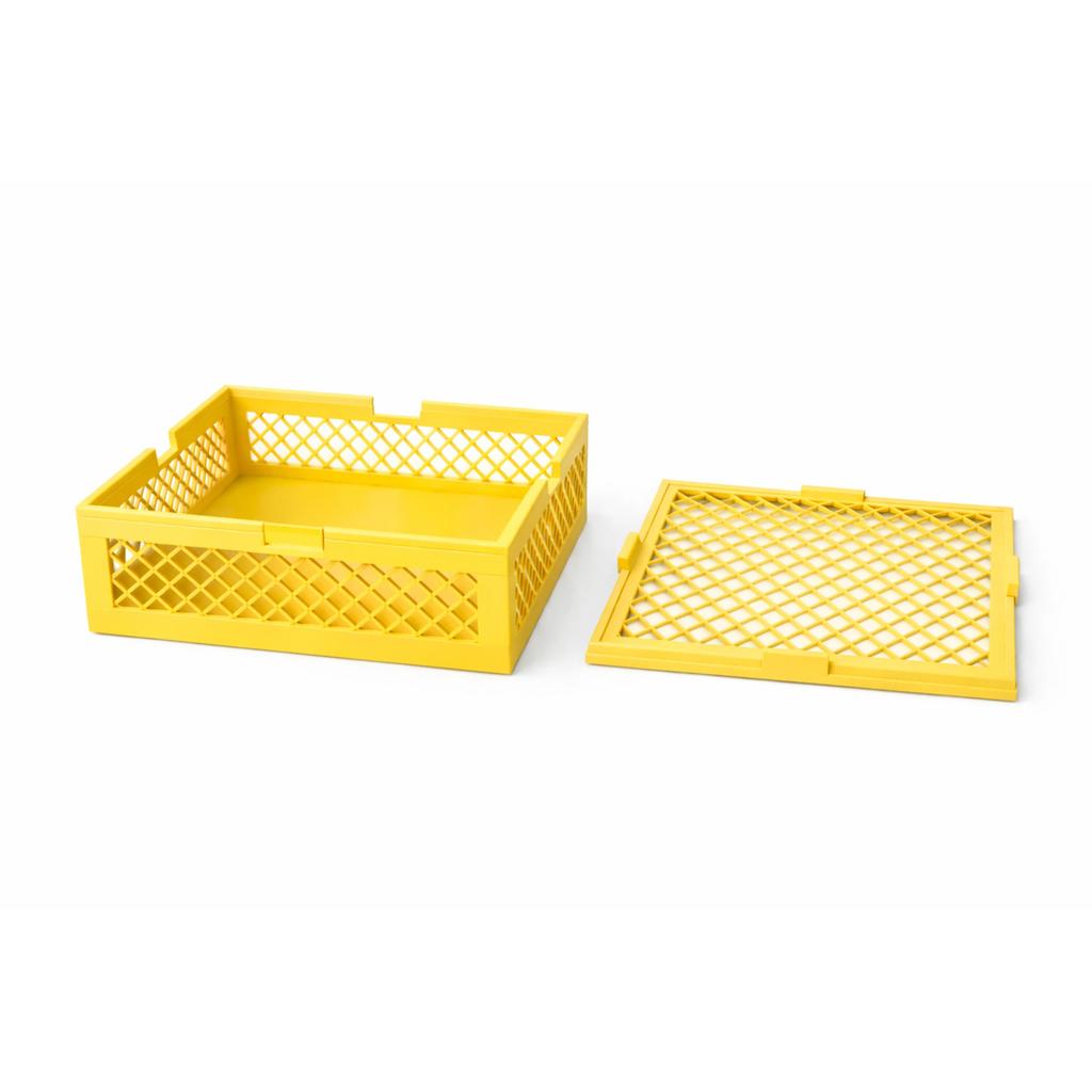 Container with a lid, yellow openwork organizer for small items for the home