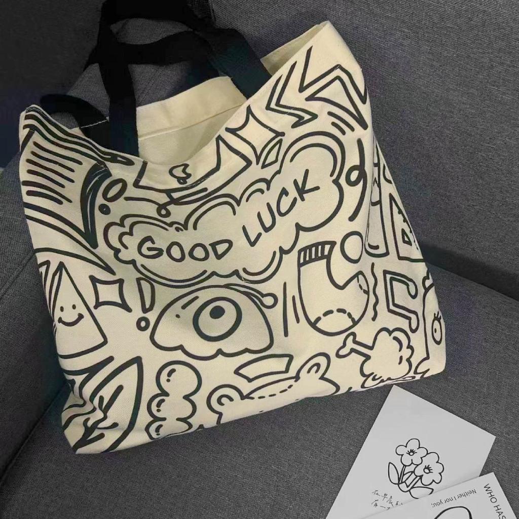 Koreanische Version der Stofftasche für weibliche College-Studenten, niedliche Umhängetasche für den Unterricht, große Kapazität, Tragetasche, Rucksack aus Graffiti-Canvas