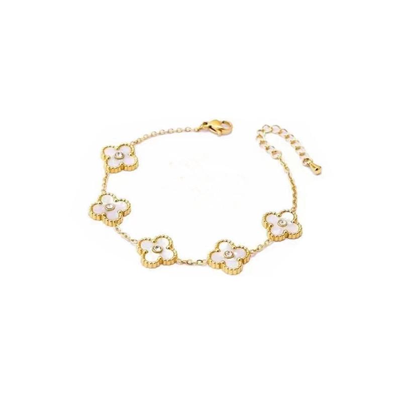Vierblättriges Kleeblatt Titan Edelstahl Armband & Ohrring Set mit Muschel Details.