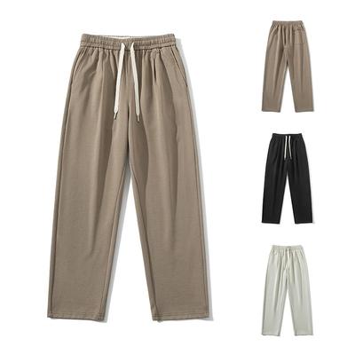 Pantalon homme printemps et automne nouveau vêtement homme simple garçon ample et polyvalent décontracté drapé fin couleur unie pantalon