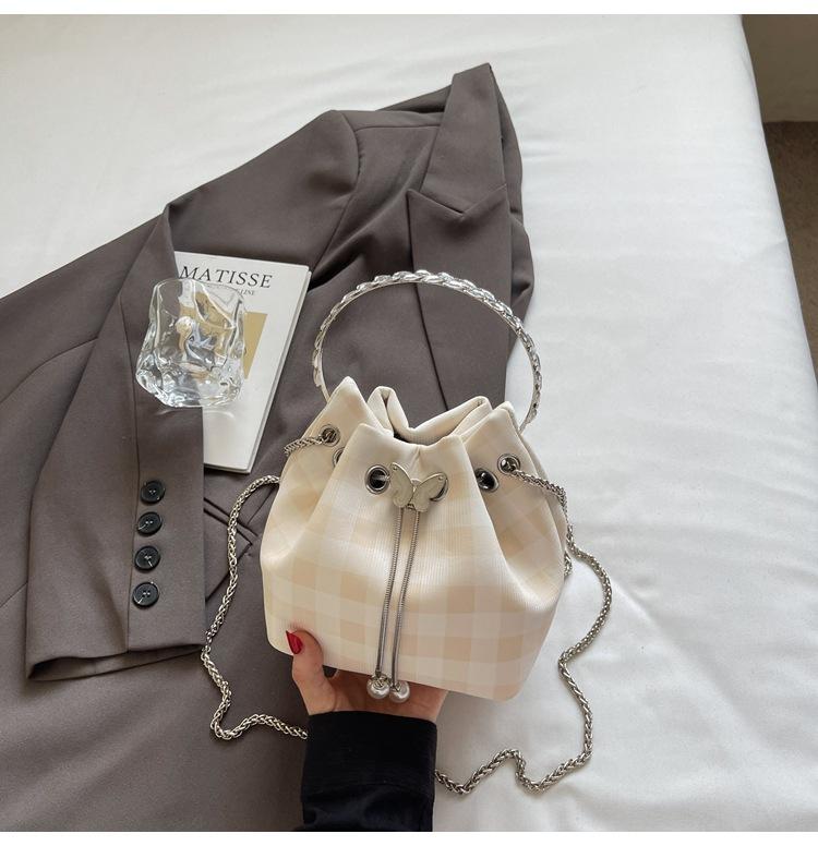 Korean niche design simple and fashionable portable small bag women's 2025 summer new crossbody plaid bucket bag tide
