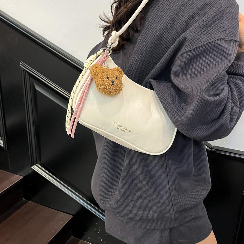 Solid color niche design simple and fashionable dumpling bag new versatile shoulder armpit messenger bag