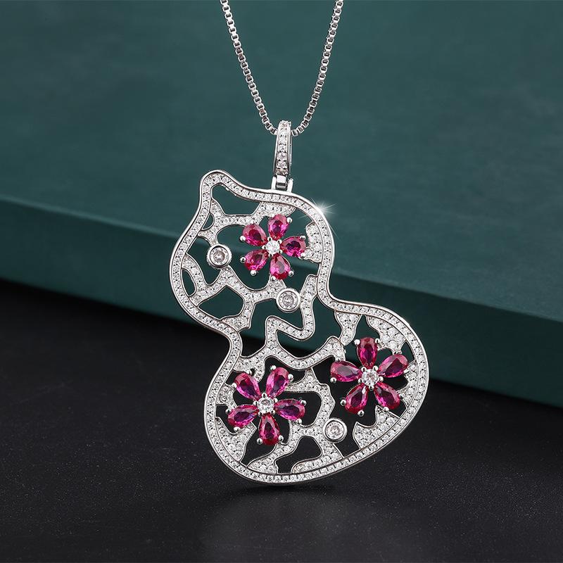 

Ювелирные изделия Медное дно Позолоченное Ветер Ретро Имитация цвета Сокровище Двухцветный камень Бриллиант Тыква Кулон Ожерелье