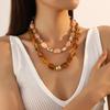 Schickes unregelmäßiges Acryl-Kettenhalsband mit Farbverlauf und VU-Goldperlen