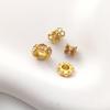Color-preserving copper-plated matte gold flower-shaped spacer beads with imitation pearl inlay for DIY jewelry.