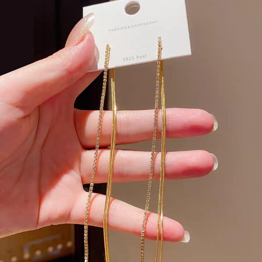 Elegant Retro-Style Snake Bone Chain Tassel Earrings for Women