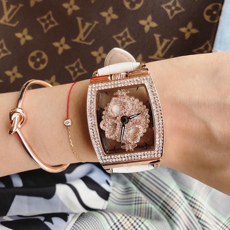 

Новые женские часы в стиле бочонка с полым прозрачным вращающимся циферблатом и стразами