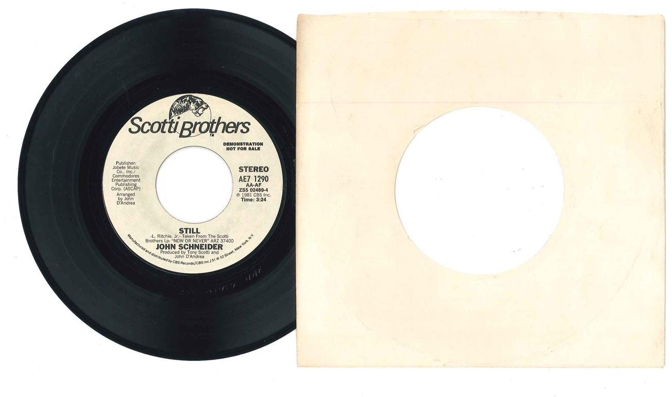 

7-дюймовая пластинка ДЖОН ШНАЙДЕР - Still AE71290PROMO SCOTTI BROS 1981 США Поп Б/У