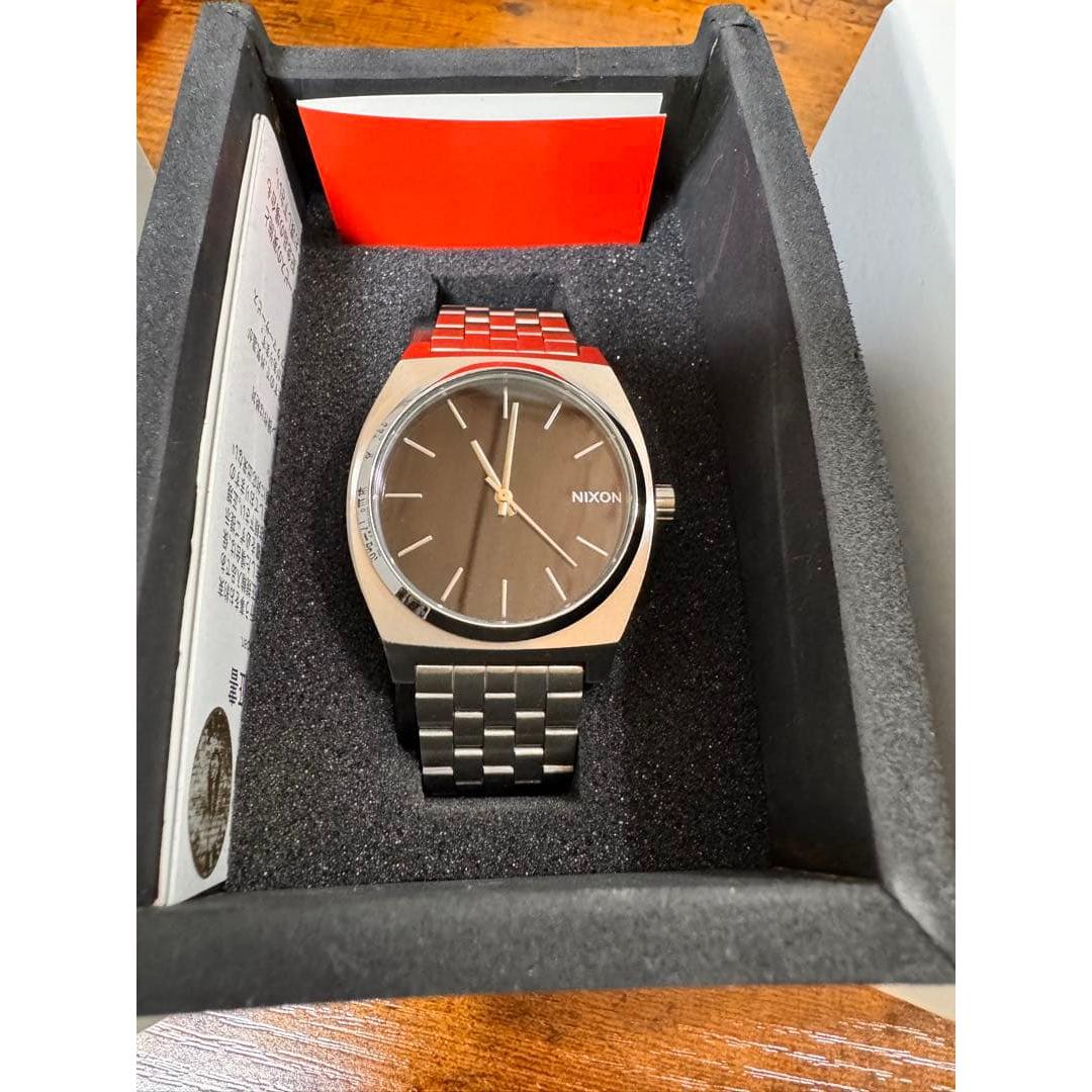 Used NIXON TIME TELLER black wristwatch in good condition with box manual working item