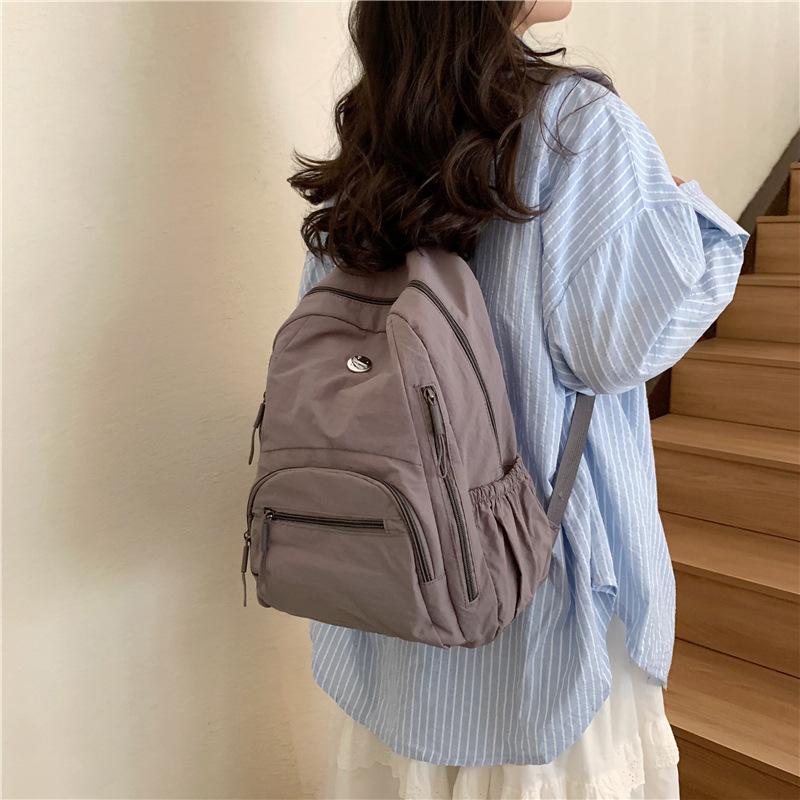 The Backpack Is Lightweight, Casual, and Has A Large Capacity. It Is A Simple and Fashionable Student Schoolbag