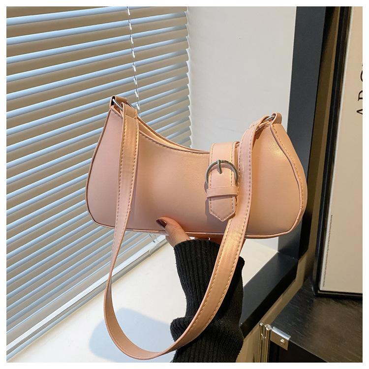 

Женская сумка под мышкой 2025 новая трендовая косая через плечо нишевая текстура одно плечо универсальный темперамент портативная сумка-багет розовый