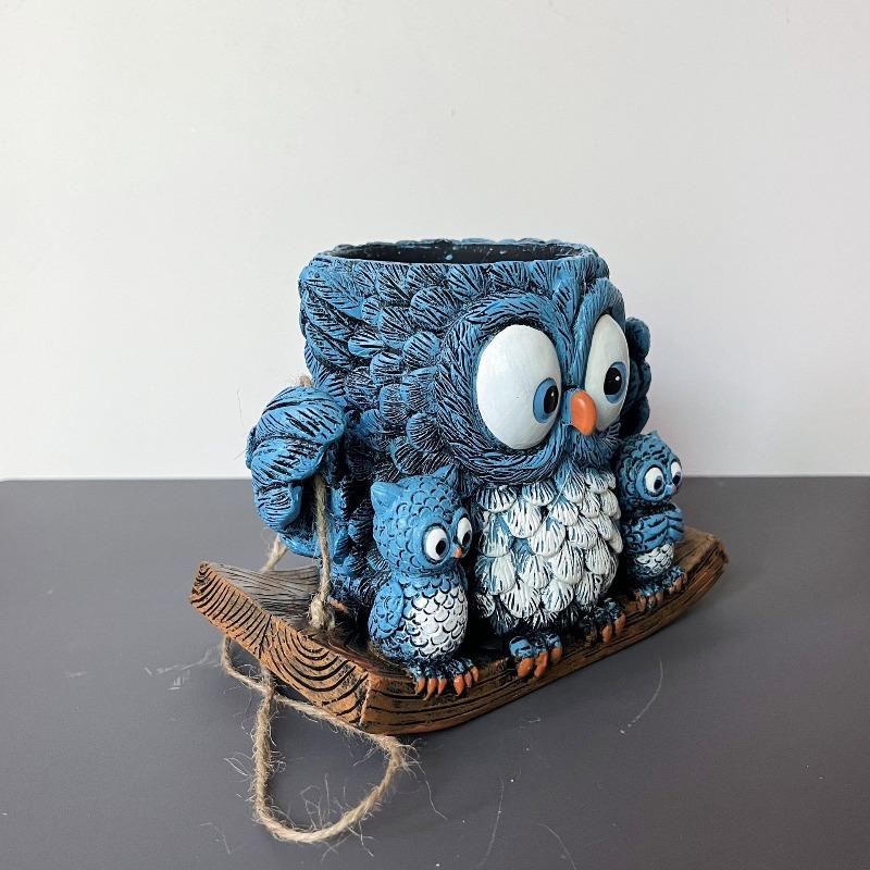 An Owl Hanging A Succulent Decoration In A Flower Pot As A Gift