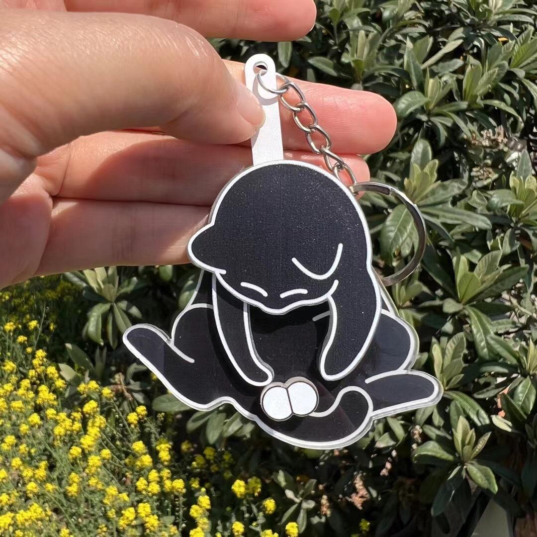

Creative abstract with Eggs keychain featuring a playing -egg. one size