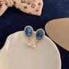 2023 Elegant French Retro Pearl Earrings: Exquisite Round Plate Design