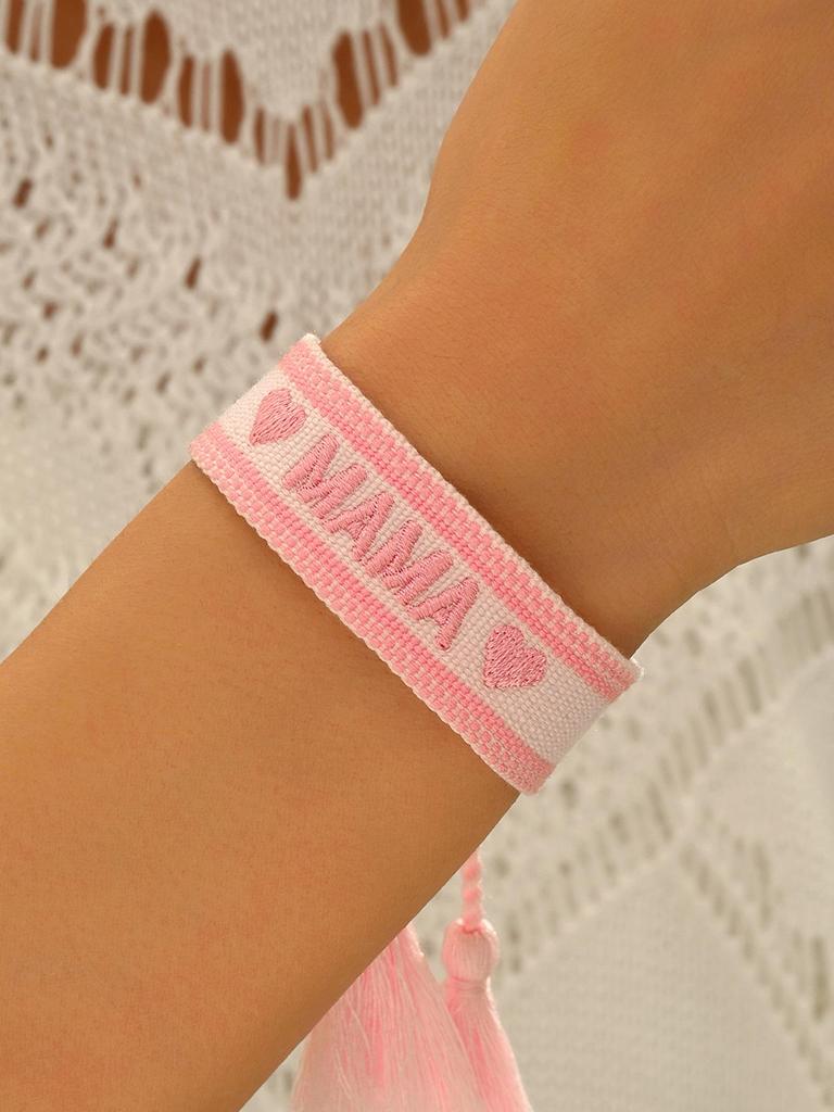 Gold Heart-Shaped Stainless Steel Bracelet with Embroidered Bow and Tassel Woven Cord.