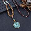 Collana unisex fatta a mano Nepal buddista Mala perline di legno ciondolo collana etnica pesce corno lunga dichiarazione
