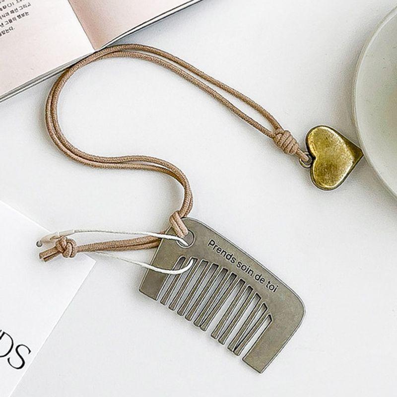 

Prends soin de toi Eclat Comb Charm Keyring baby pink