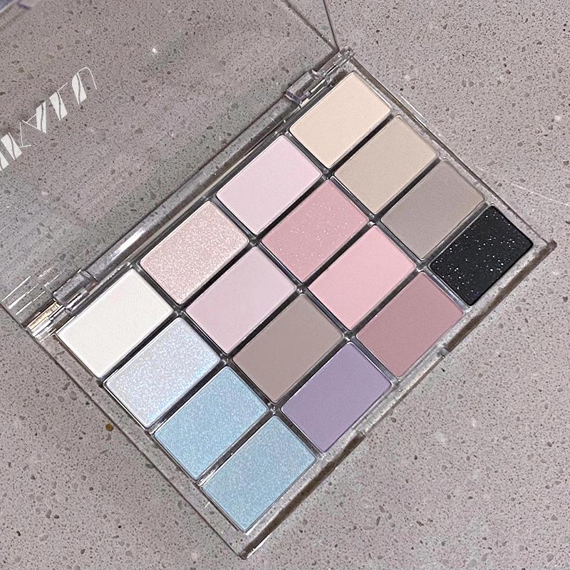 DIKALU 16-Color Eyeshadow Palette: Pearlescent & Matte Earth Tones in Gray, Pink, and Coconut Brown.