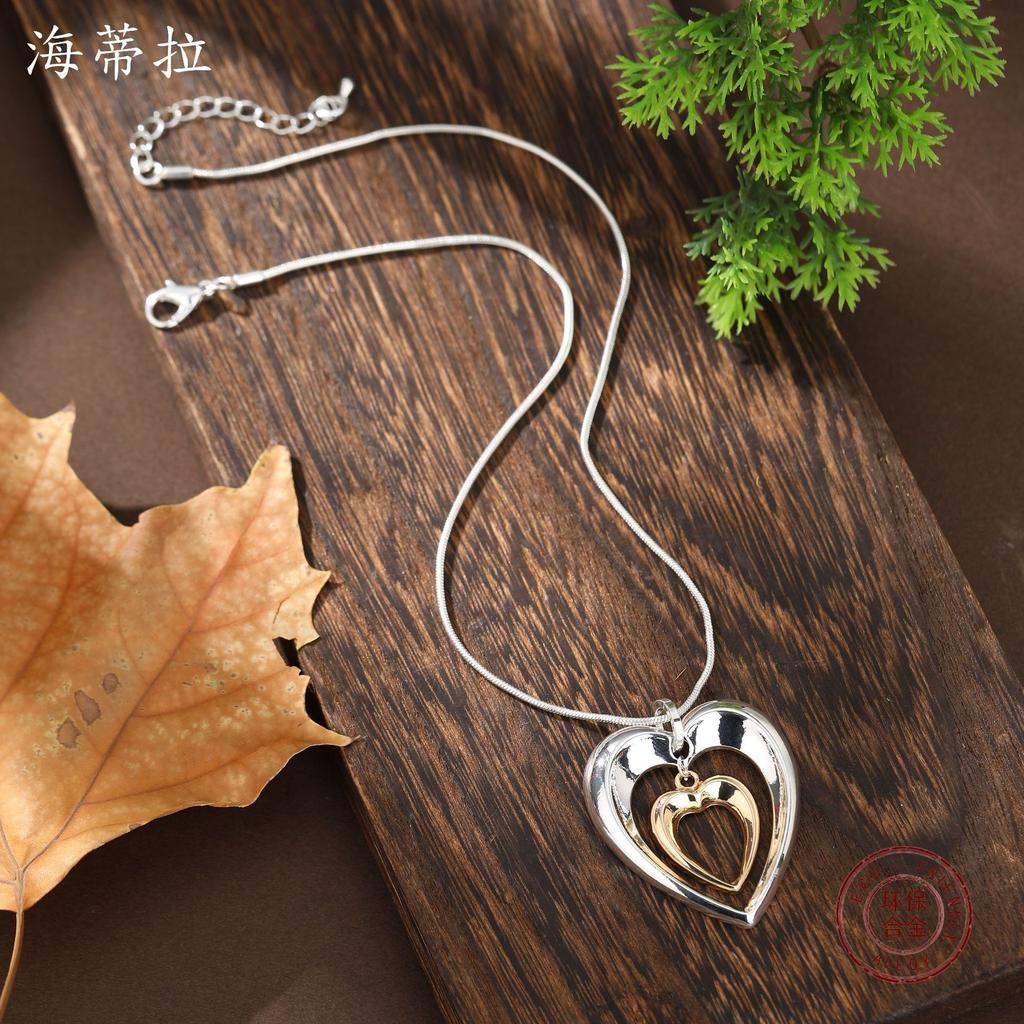 New hollow two-color love snake bone chain pendant, women's fashion high-end glossy heart-shaped neck chain