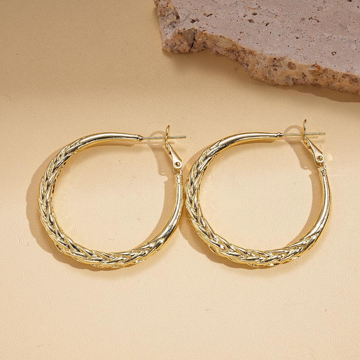 Metallic geometric round twist pattern silver needle earrings versatile temperament niche earrings