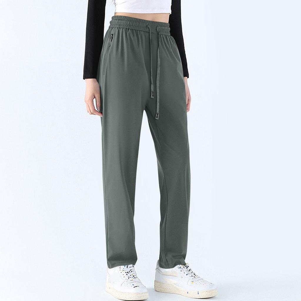 Kvinners uformelle ensfargede elastiske midje Rett uformelle bukser med lommer