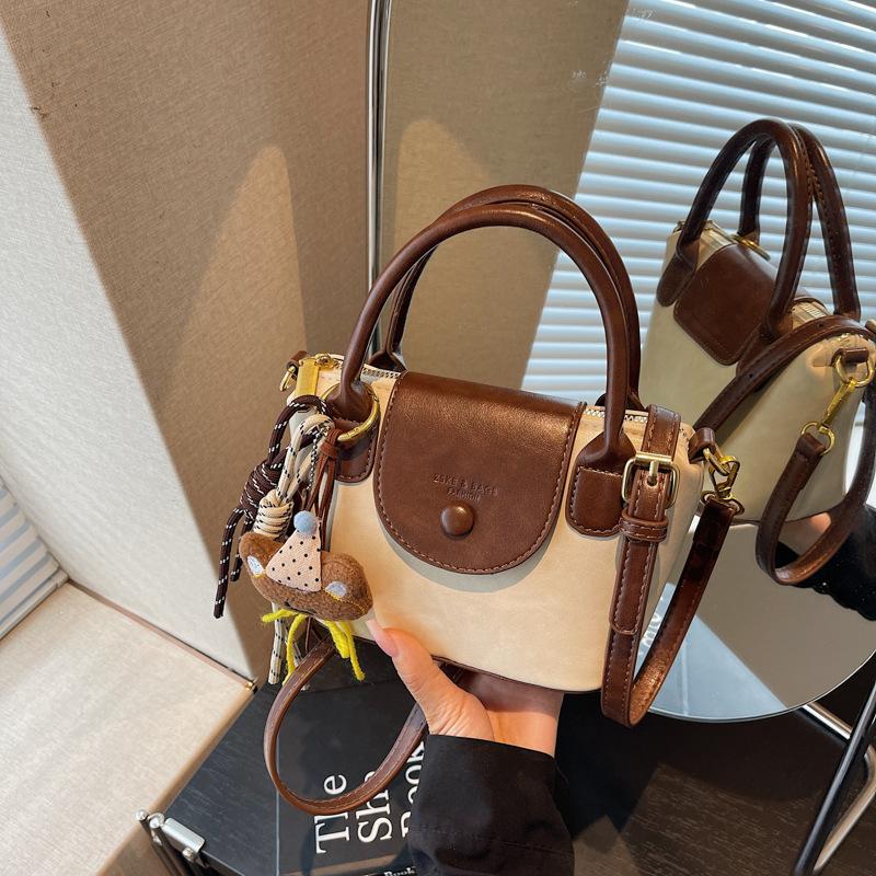 Retro handbag women's 2025 new trendy high-end color contrasting fashion shoulder bag commuter messenger dumpling bag