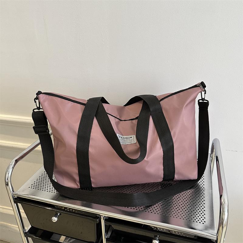 

Зима 2024 новий темпераментний модний дизайн на одне плече через плече великої ємності в іноземному стилі однотонна проста дорожня сумка через плече цвітіння вишні, рожевий колір