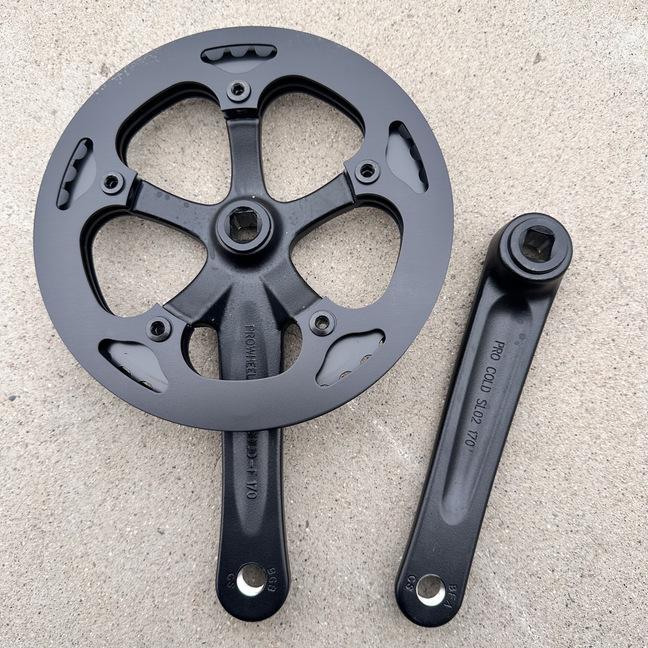 Compact Folding Road Bike with 46-Tooth Single-Piece Crankset and Double Chainring Guard