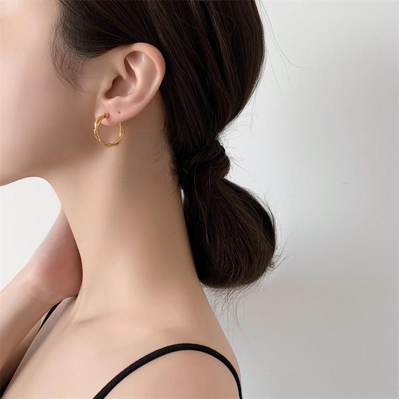 French Retro Gold-Plated Twisted Hoop Earrings - Titanium Steel Studs for Women, European-American Fashion.