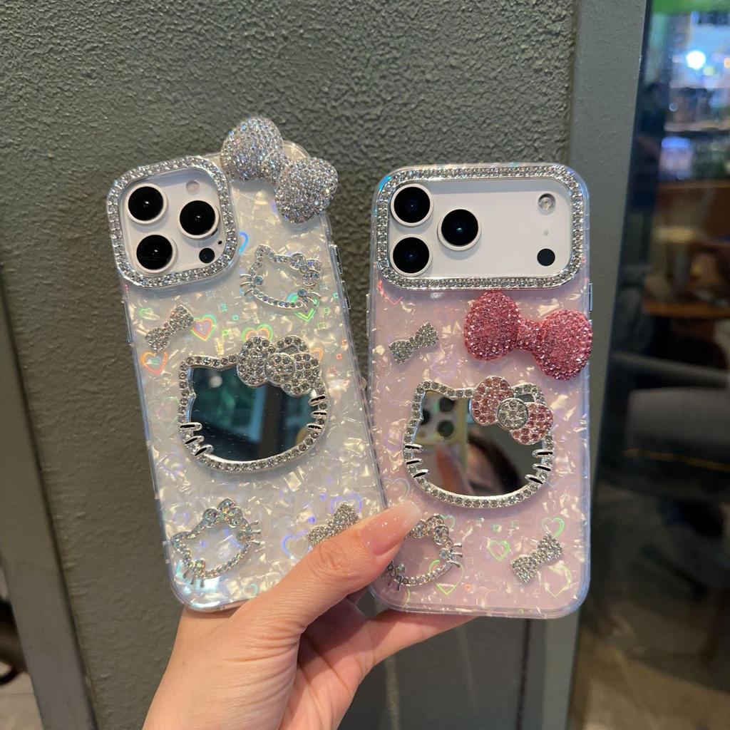 KT Cat Mirror Phone Case for Apple 16/17 Pro Max with Flashing Diamond Bow and Textured 14/15 Design.