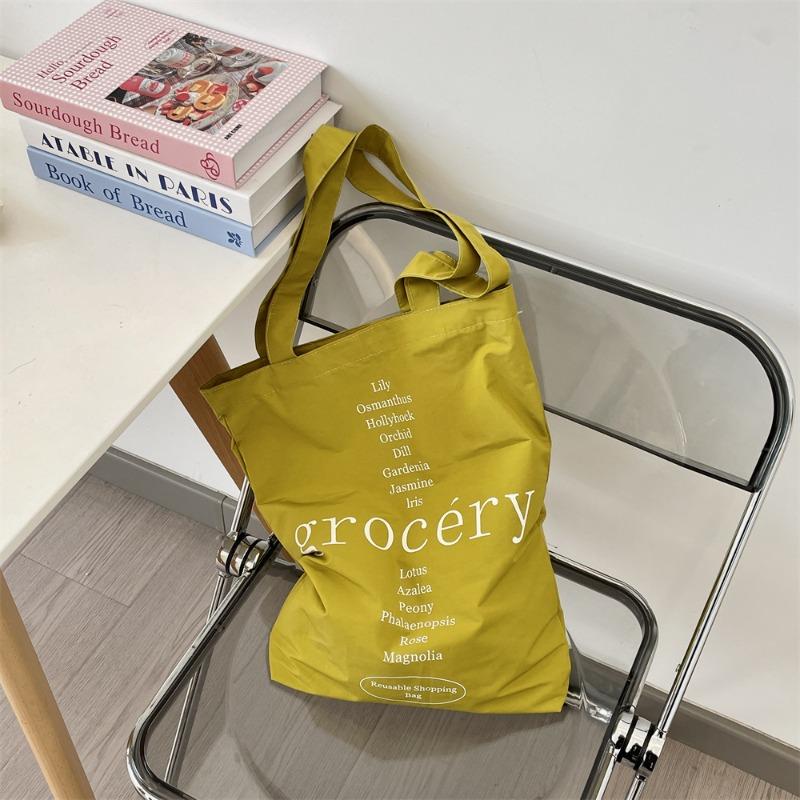 

1 letter printed new casual canvas bag women s bag shoulder bag large capacity student bag жёлтый