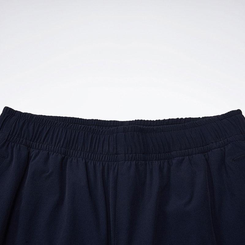 Reebok Jednobarevné volné tkané rovné nohavice Ležérní kalhoty Dámské kalhoty Námořnická modrá 24SRC612WGN2