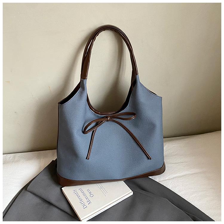 Retro commuter niche bow single shoulder armpit bag 2025 Korean version new fashion simple contrasting color tote bag