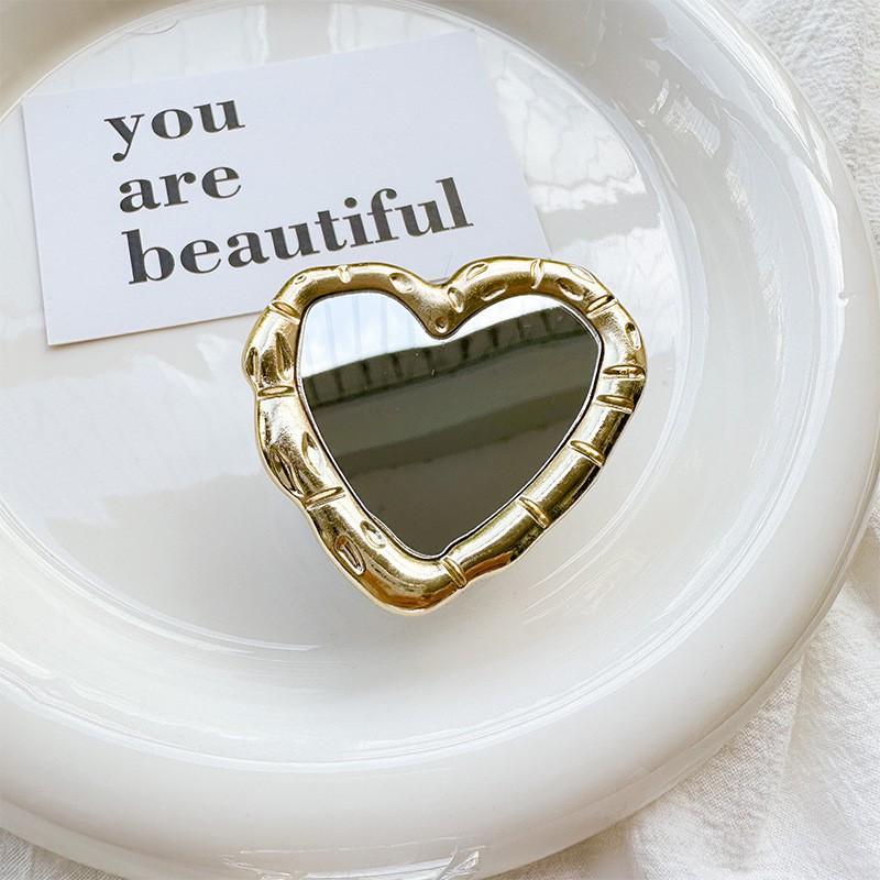 

Electroplated Metal Lines Heart-shaped Mobile Phone Airbag Holder Mirror Sticker Portable Touch Up Watch TV Show