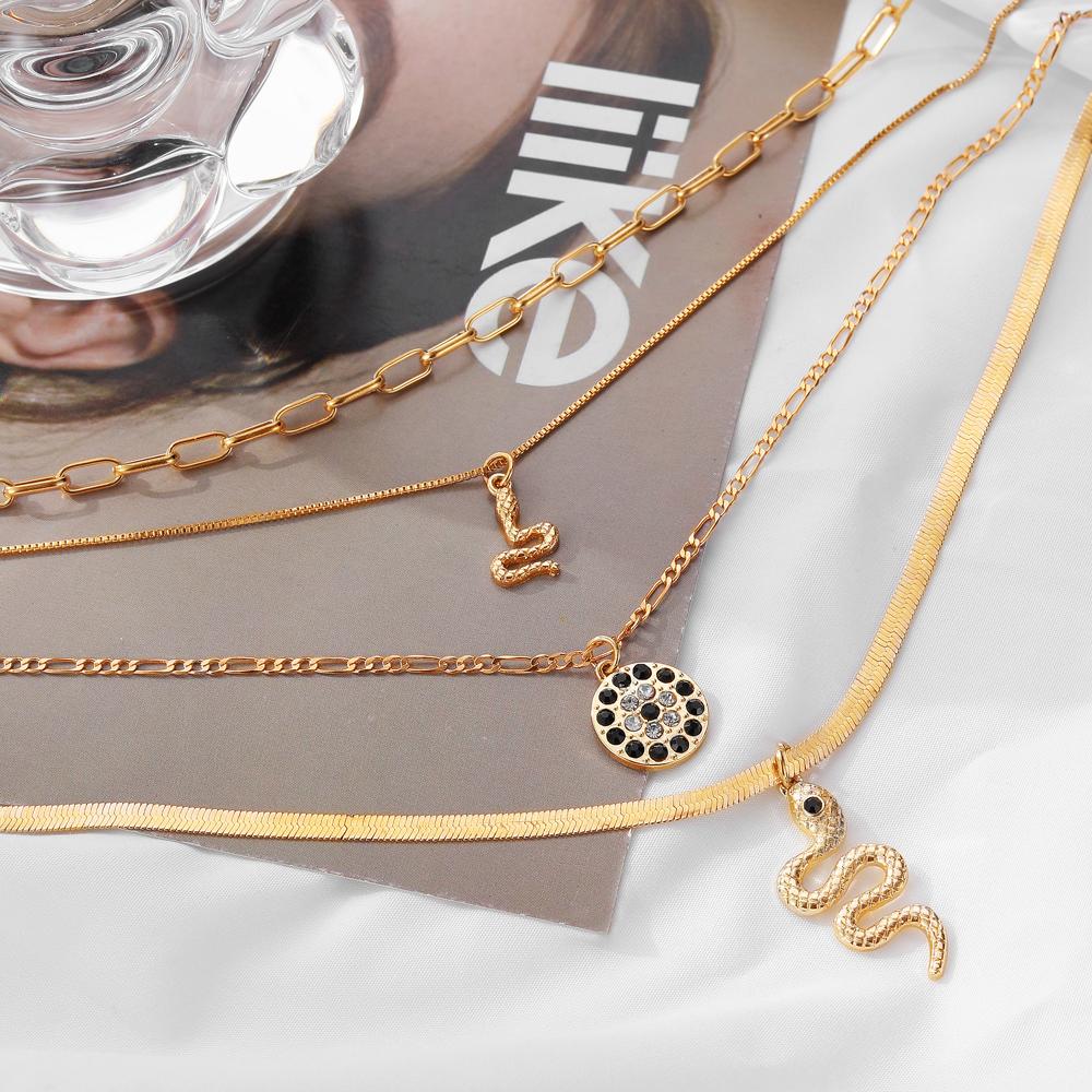 Four Piece Snake Necklace Women's Fashion Hollow Out Necklace Personality Bohemian Sweater Chain Elegant Snake Pendant