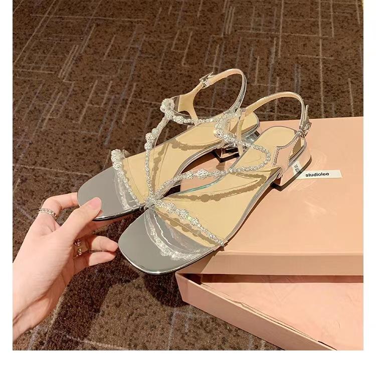

Grape mother has the same 2025 summer new Korean version of square head flash diamond with high heels women s shoes thick heels sandals 40 серебряный