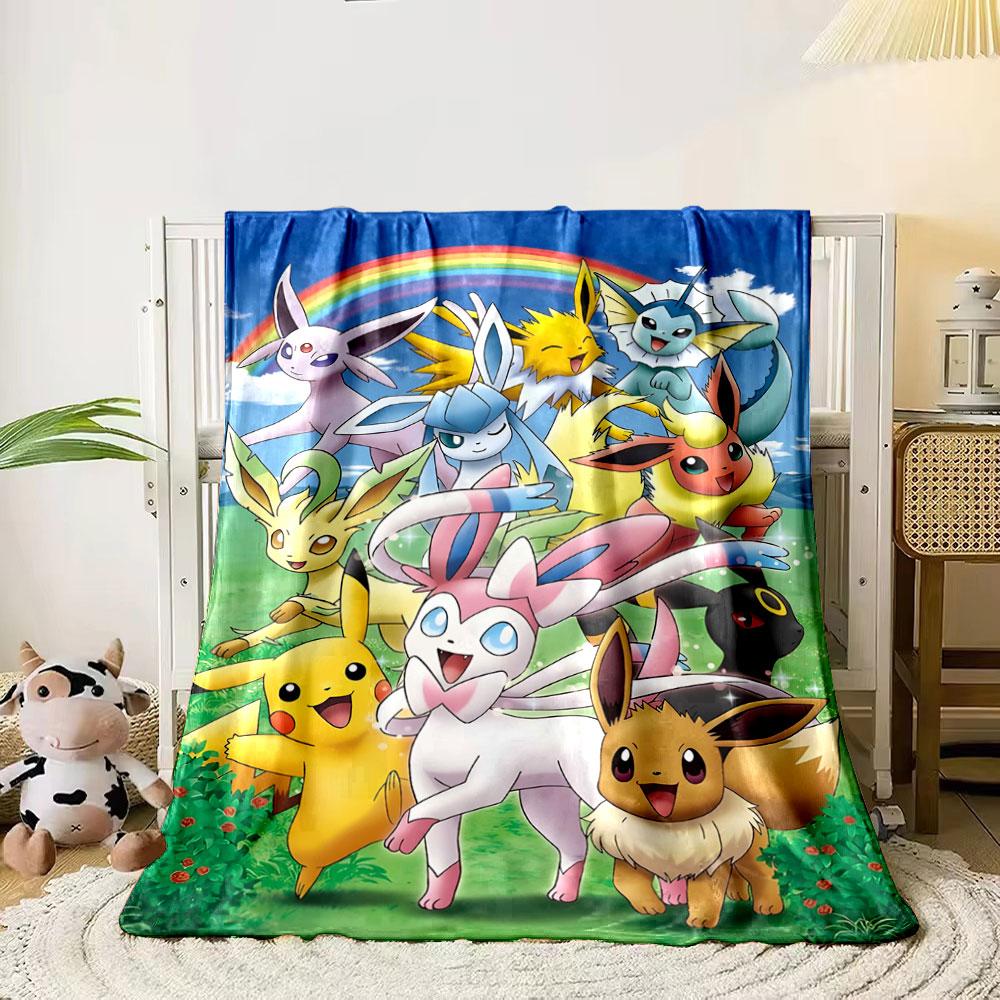 

A group of colorful, fantasy creatures with a rainbow in the background. for all seasons blanket lunch break throw gift 80cm x 120cm