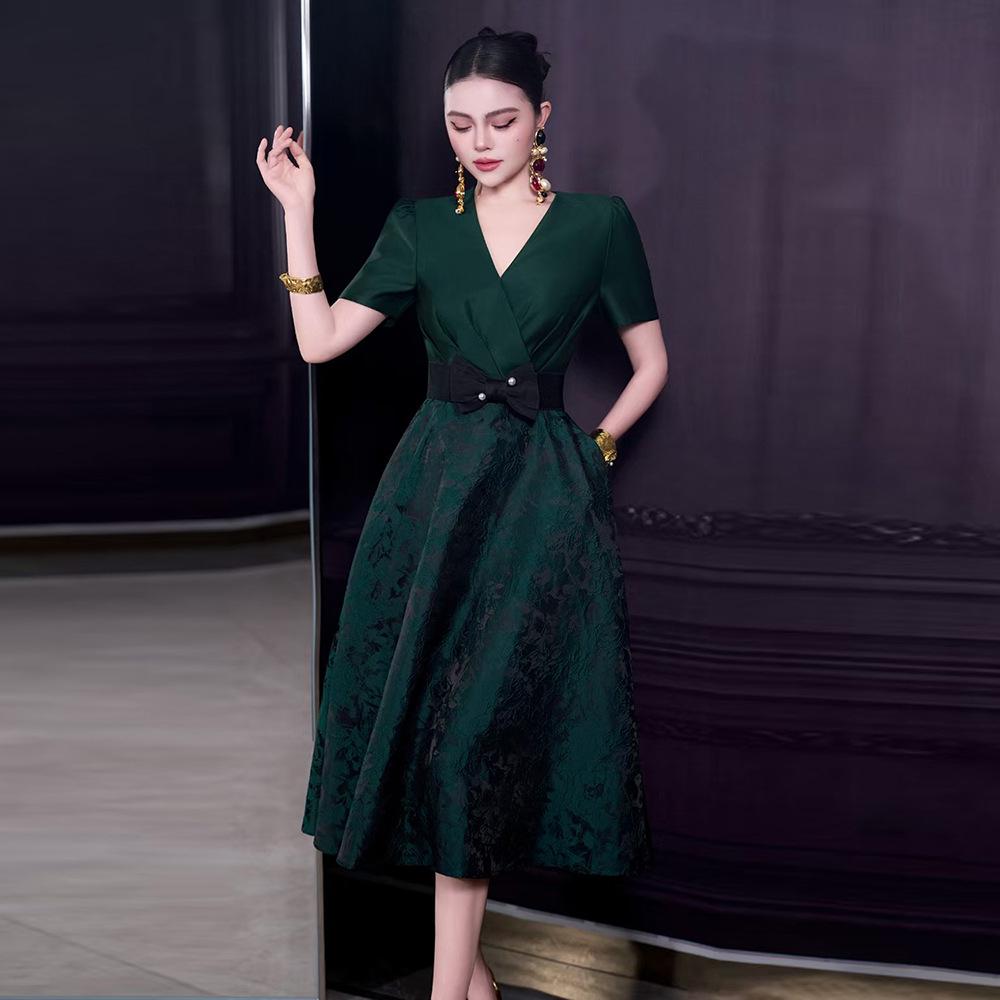 French Spring/Summer 2026 Women's V-Neck Black Bow Tie Jacquard Dress with Waist-Cinching and Wide Hem.