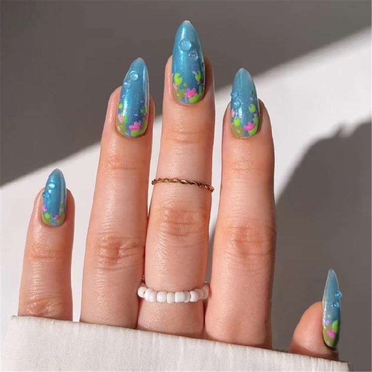 

24Pcs Christmas Press On Nail Medium Almond Artificial Nail with 3D Blue Color Designs Nail Accesories for Women 1