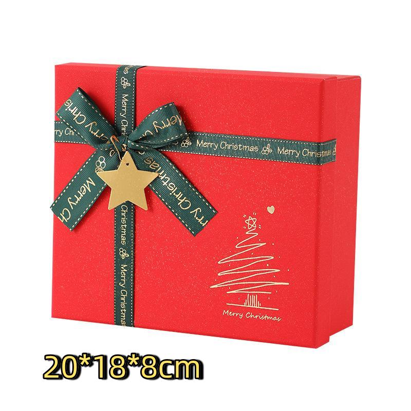 Red Christmas Gift Box With Shiny Surface Green Ribbon Gold Star Ornament Ideal For Holiday Gift Wrapping